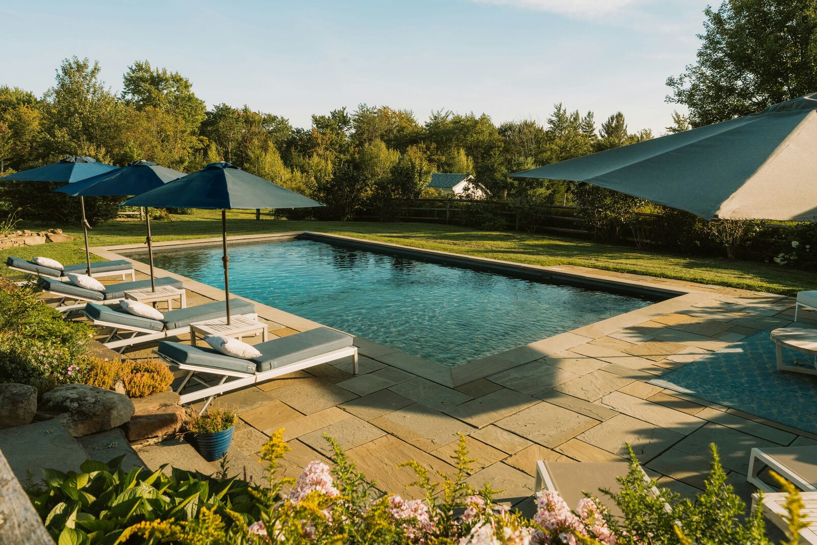 Pool deck with umbrellas and loungers
